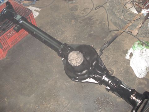 1980 Ford Bronco - A black Ford Dana 44 axle assembly is shown, possibly undergoing restoration or repair.