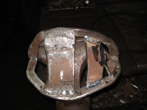 1980 Ford Bronco - A heavily modified differential housing, likely for off-road use, shows extensive welding and fabrication work.
