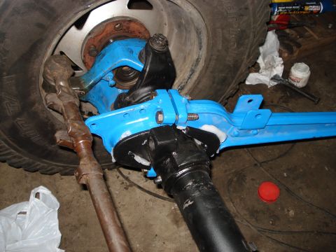 1980 Ford Bronco - Front axle and steering linkage components, likely for an off-road vehicle modification.