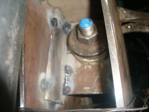 1980 Ford Bronco - Close-up of a welded metal bracket and bolt assembly.