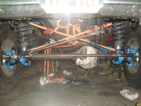 1980 Ford Bronco - Custom suspension and steering components on a vehicle, possibly undergoing modification or repair.