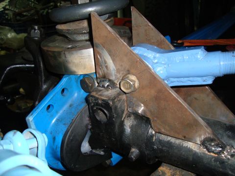 1980 Ford Bronco - Custom suspension modification with welded steel plates and blue painted components.