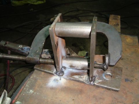 1980 Ford Bronco - A custom-made metal clamp assembly, likely for automotive repair or fabrication, is shown up close.