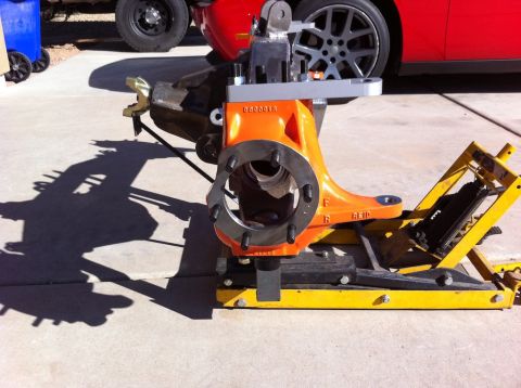 Suzuki Samurai - Front axle assembly on a jack, with part number 000001R visible.
