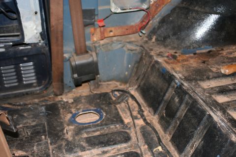 1989 Ford Bronco - Interior view of a vehicle's floor, showing wear and tear.