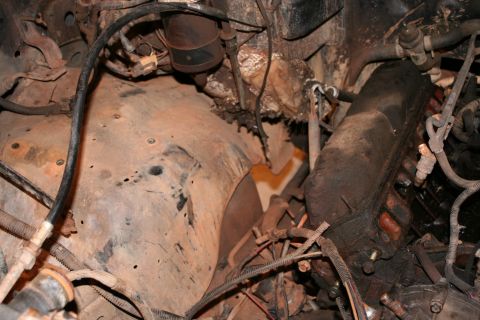 1989 Ford Bronco - Close-up view of the engine bay, showing various hoses, wires, and engine components.