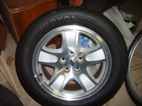 1993 Ford Crown Victoria - This is a close-up of a Ford wheel and Uniroyal tire, not a 1993 Ford Crown Victoria.