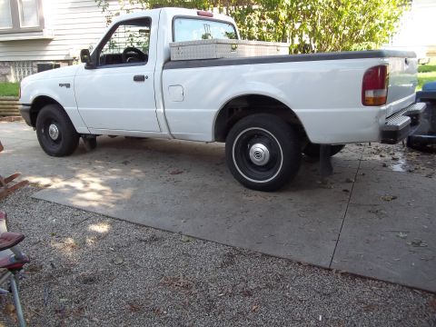1970 Ford Ranchero - White Ford Ranger pickup truck with a toolbox in the bed.