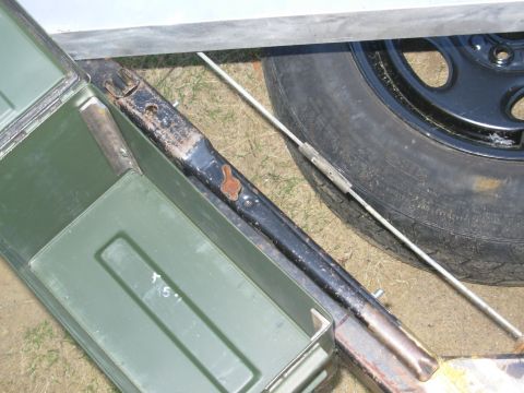 2004 Land Rover Land Rover - The ammo can will hold straps, spare lug nuts, tire chocks (etc.), and the lug wrench stows neatly beside it. Everything will be hidden & s…