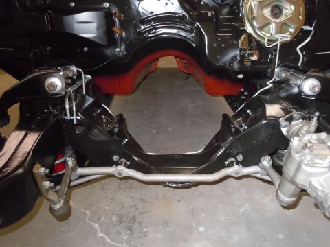 1973 Pontiac Trans Am - Close-up of a vehicle's front suspension and frame components, likely during restoration.