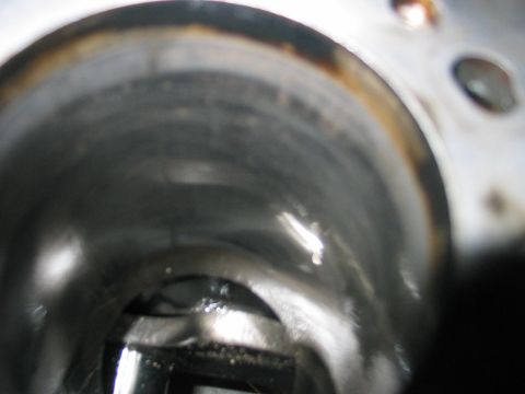 1984 Ford Bronco - This is a close-up view inside an engine cylinder, revealing its internal condition and potential wear.