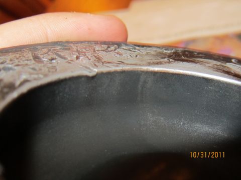 1984 Ford Bronco - A close-up view of a textured metal part, with a date stamp of 10/31/2011 and Supermotors.net logo visible.