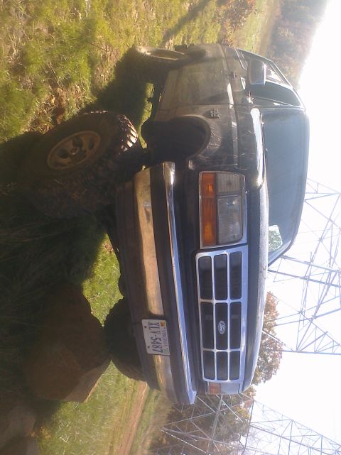 1995 Ford Bronco - This 1995 Ford Bronco is shown with off-road tires on a grassy area.