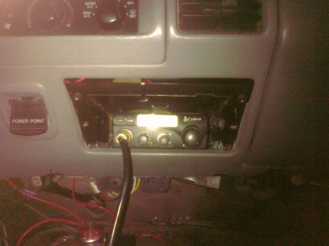 1995 Ford Bronco - A Cobra CB radio is mounted in the dashboard, with wiring visible below.