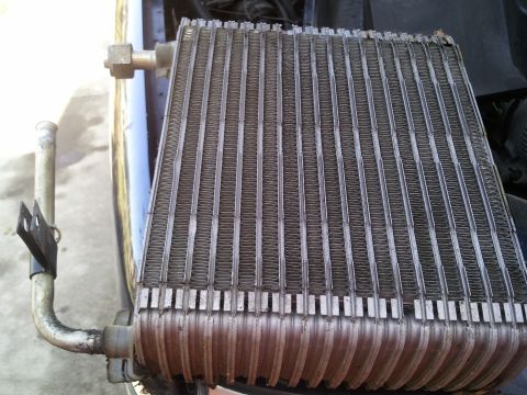 1994 Ford Bronco - A car's AC evaporator core is shown, a component of the vehicle's climate control system.