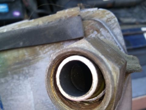 1994 Ford Bronco - Close-up view of an AC system component, showing a threaded fitting and internal tube. The registry claims it is from a 1994 Ford Bronco.