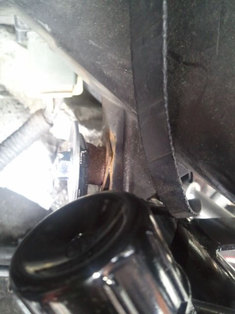 1994 Ford Bronco - Detail of an AC system component, showing rust on a bolt and surrounding wiring.