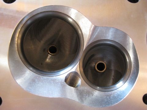 1972 Ford Ranchero - Engine cylinder head showing intake and exhaust ports, with visible threading for a sensor or fitting.