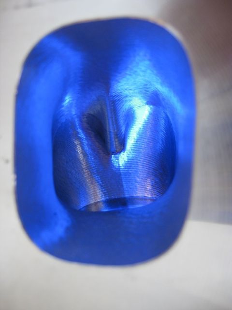 1972 Ford Ranchero - Close-up of a blue-coated engine intake port showing machined texture.