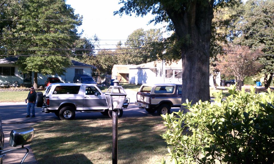 1979 Ford Bronco and another Bronco parked on street