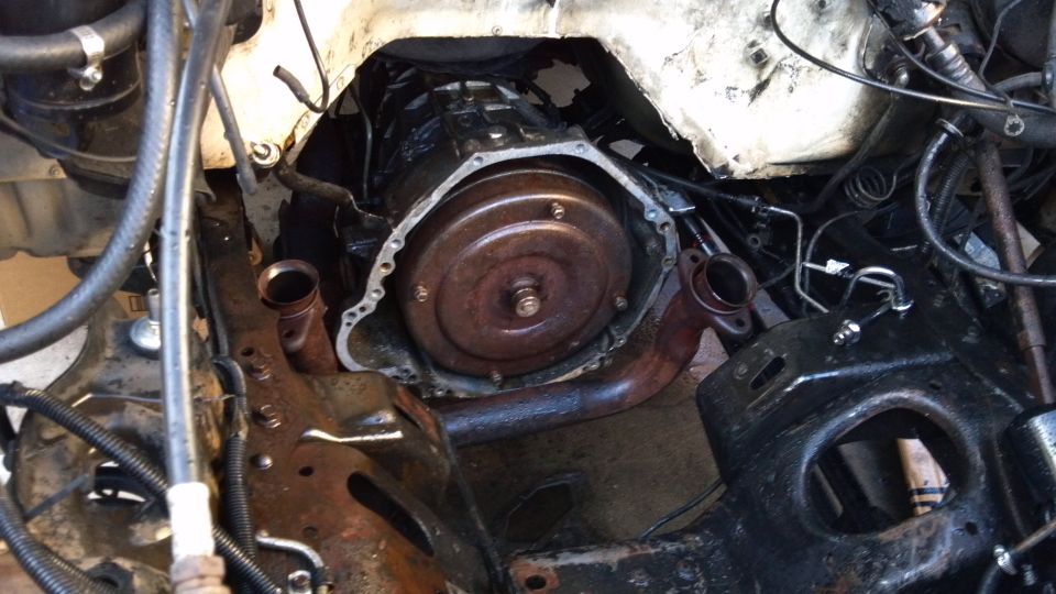 engine bay looking better after some cleaning. Looks like the power steering fluid leaked everywhere at some point because it was nasty in there.