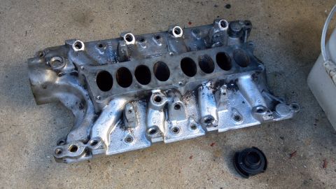 1990 Ford Bronco - wire wheeled the gaskets off and pressure washed it. Gotta clean the rest of the gunk off, but it looks 100 x better already