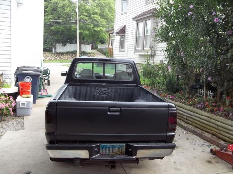 1970 Ford Ranchero - Rear view of a black Ford Ranger pickup truck parked in a driveway.