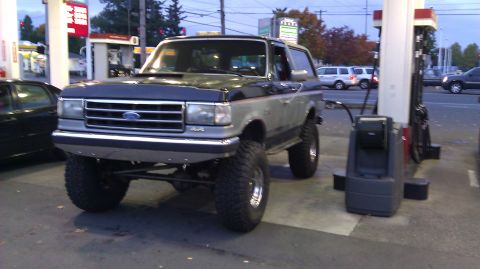 1989 Ford Bronco - This lifted 1989 Ford Bronco is seen at a gas station, possibly refueling.