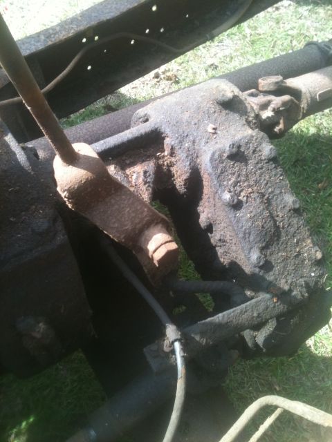 1993 Ford Bronco - Close-up view of the undercarriage components, showing significant rust and grime.