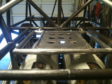 1966 Ford Bronco - Interior view of a custom-built vehicle frame with exposed suspension parts.