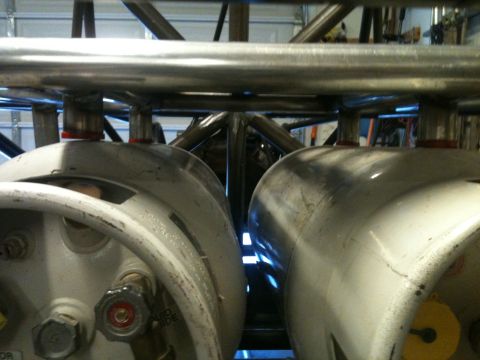 1966 Ford Bronco - Close-up view of fuel tanks and roll cage components in a custom build.