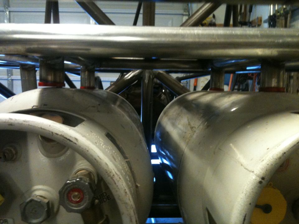 Two large cylindrical fuel tanks mounted within a metal roll cage structure