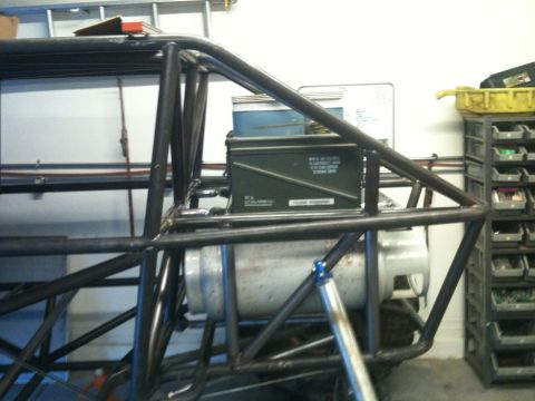 1966 Ford Bronco - Interior view of a custom roll cage, an ammo can and a large fuel tank.