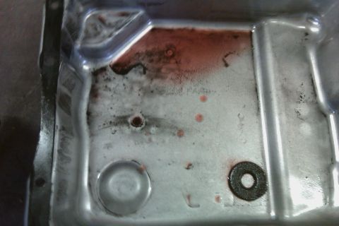 2005 GMC Yukon - Clutch material in pan