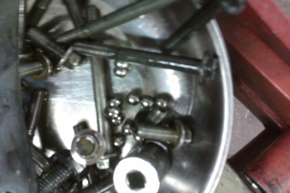 Bolts and ball bearings in a metal bowl