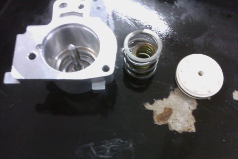 2005 GMC Yukon - Plastic 1-2 ACC piston, replaced with Sonnax pinless piston