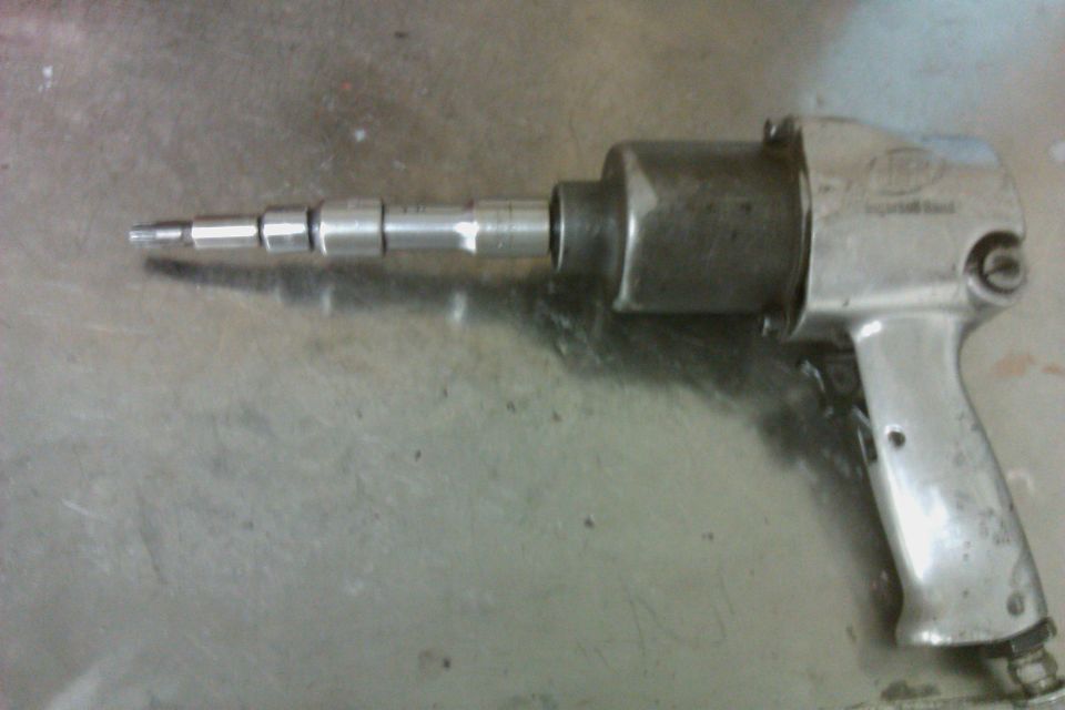 Silver air impact wrench with stepped socket adapter