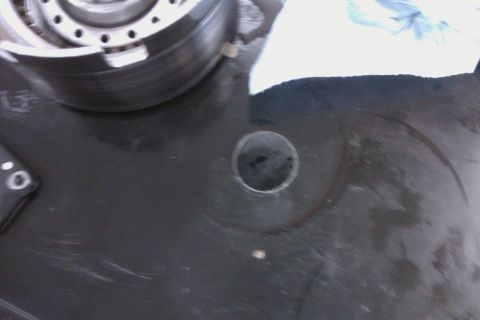 2005 GMC Yukon - Close-up view of a transmission component, possibly during a rebuild process.