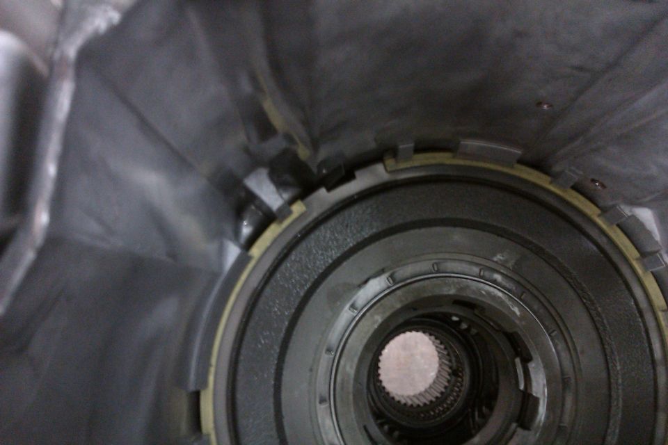 Close-up of a transmission's internal components, showing splines and metal rings