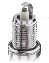 1990 Ford Bronco - A detailed view of a single spark plug, showing its metallic threads and ceramic insulator.