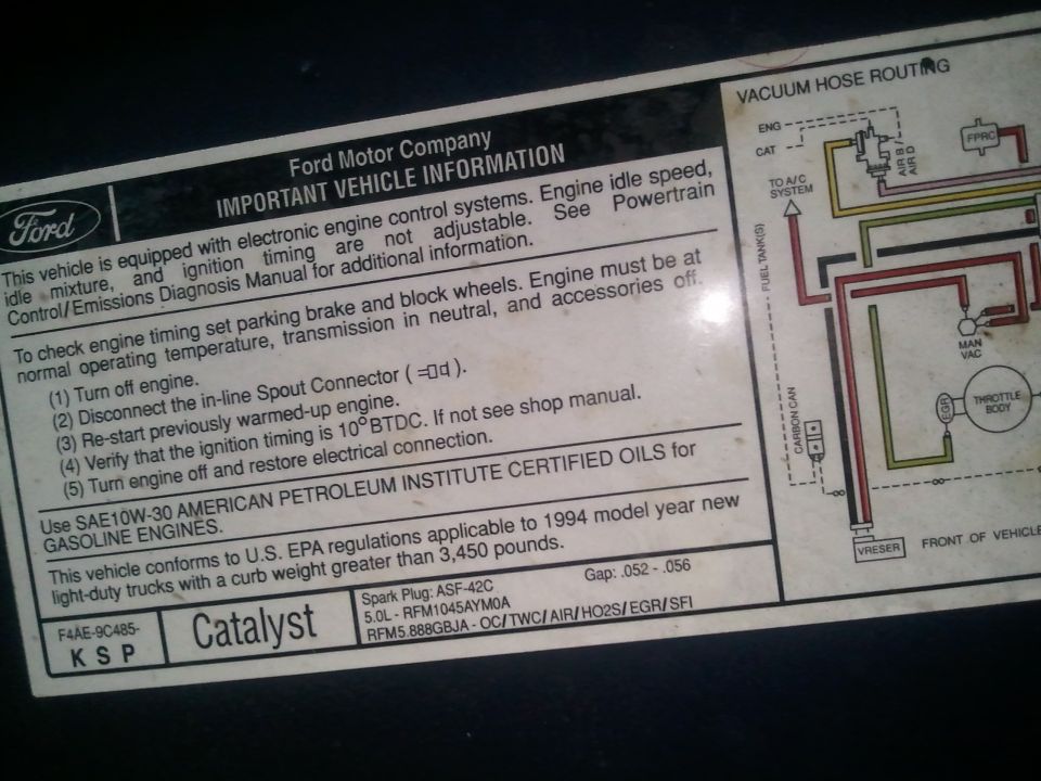 Ford VECI underhood label with engine specs and a color-coded vacuum hose routing diagram