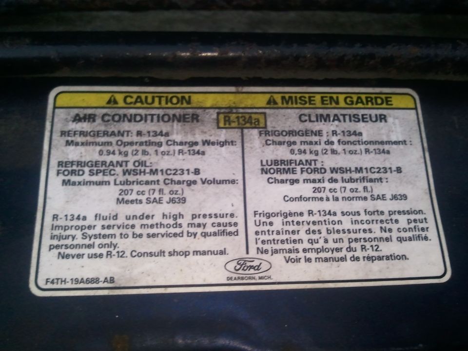 Ford air conditioner R-134a refrigerant and lubricant charge specification caution label