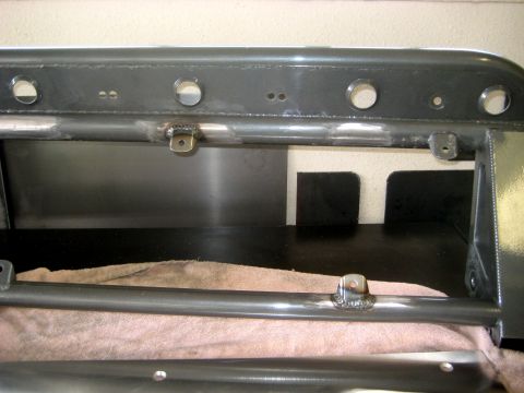 1996 Ford Bronco - Custom metal fabrication with welded brackets and mounting holes, likely for an off-road vehicle part.
