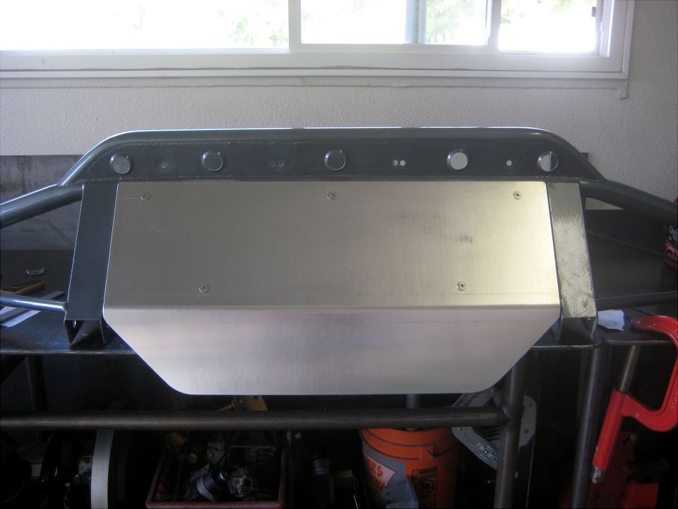 Custom front bumper with skid plate, bolted to a frame