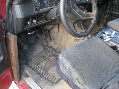 1981 Ford Bronco - Interior view of a 1981 Ford Bronco, highlighting the dashboard, steering wheel, pedals, and floor mats.