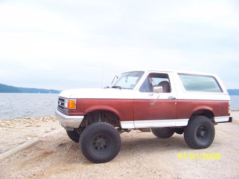 1989 Ford Bronco - 1989 Ford Bronco with lifted suspension sits by the water on a cloudy day. Date stamp reads 01/01/2008.