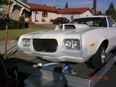 1972 Ford Ranchero - Front view of a 1972 Ford Ranchero being loaded onto a trailer.
