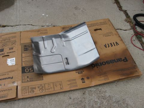 1981 Ford Bronco - A new metal floor pan replacement part is shown resting on a large cardboard box.
