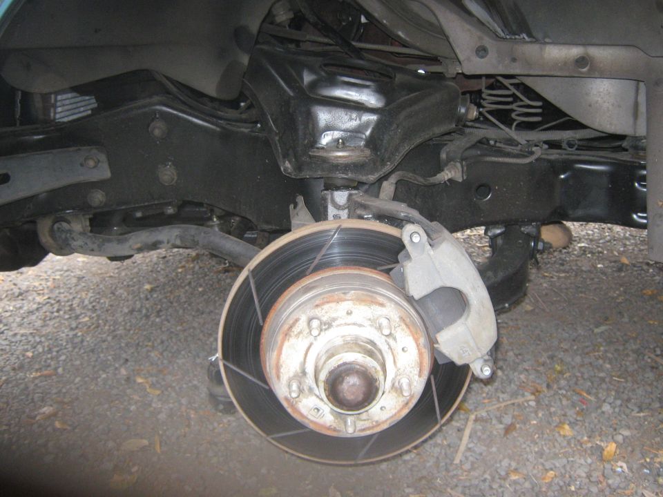 Front suspension and brake assembly with rotor and caliper