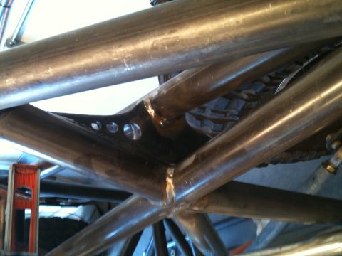 1966 Ford Bronco - Metal roll cage tubing and a tire are visible in this close-up shot.